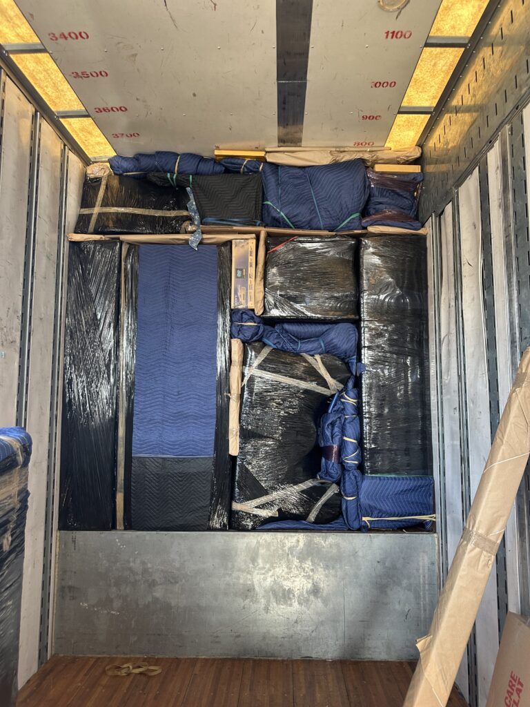 A fully packed moving truck with professionally secured items, demonstrating Pattons Movers' efficient packing services in Winchester, VA.